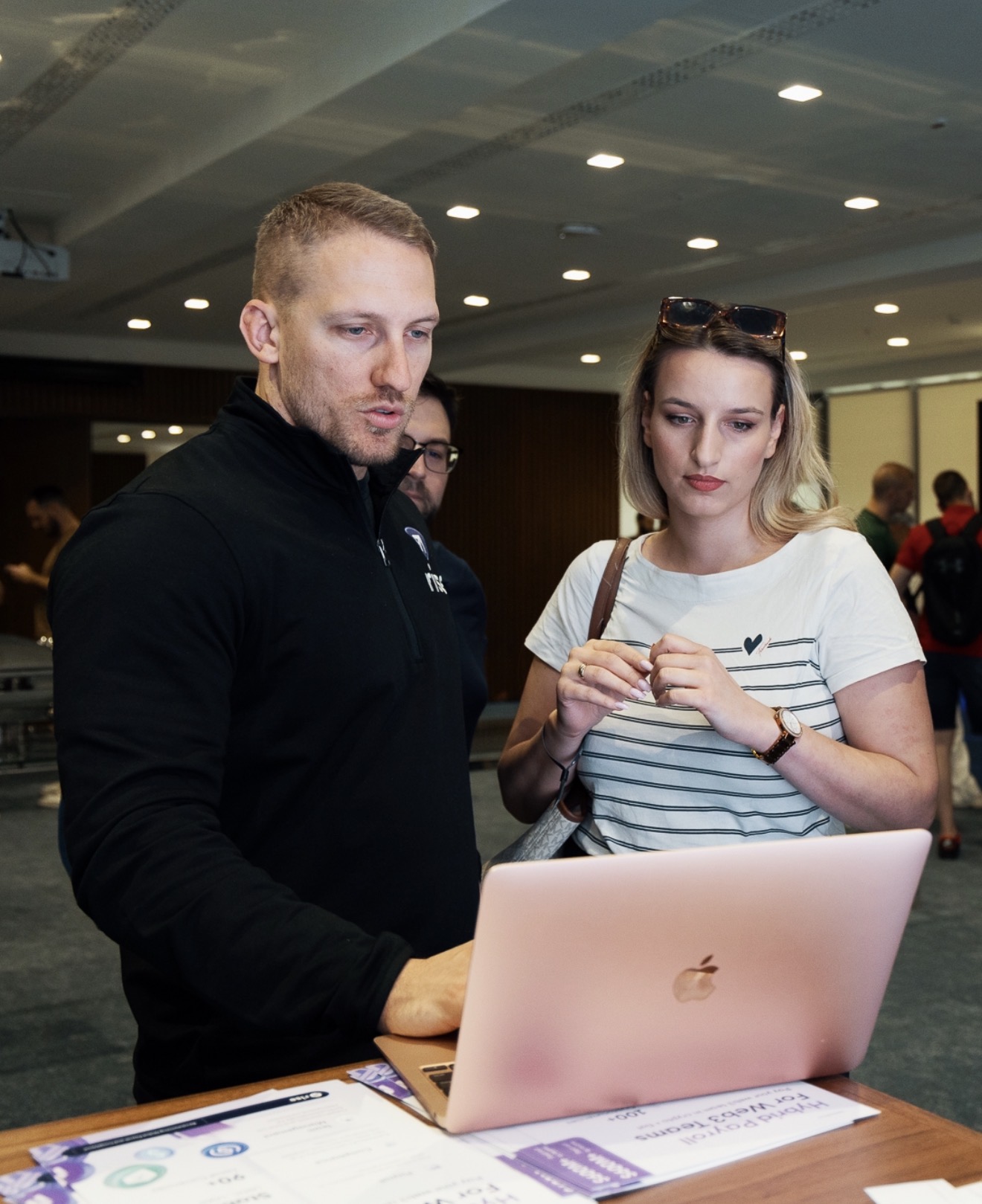 Austin and others gathered around a laptop
